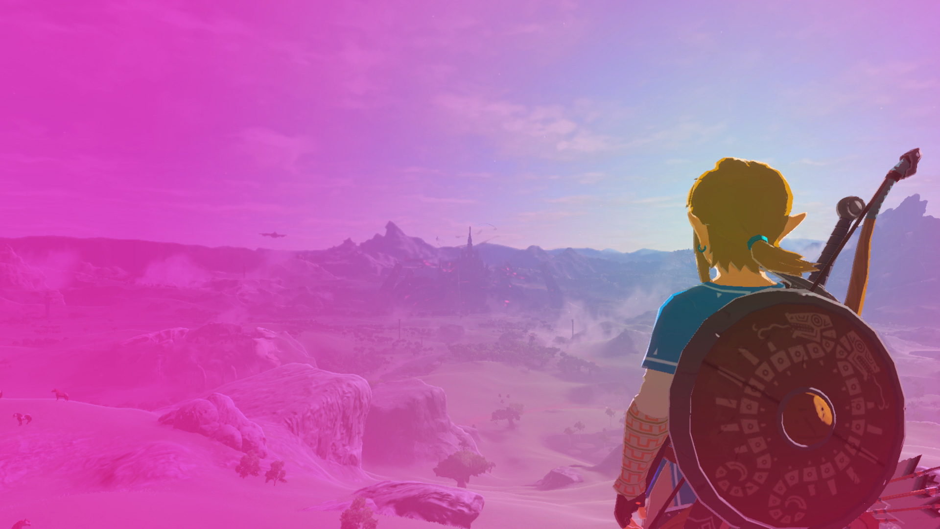 Link stands on a mountainside, gazing upon Hyrule’s vast expanse in Breath of the Wild