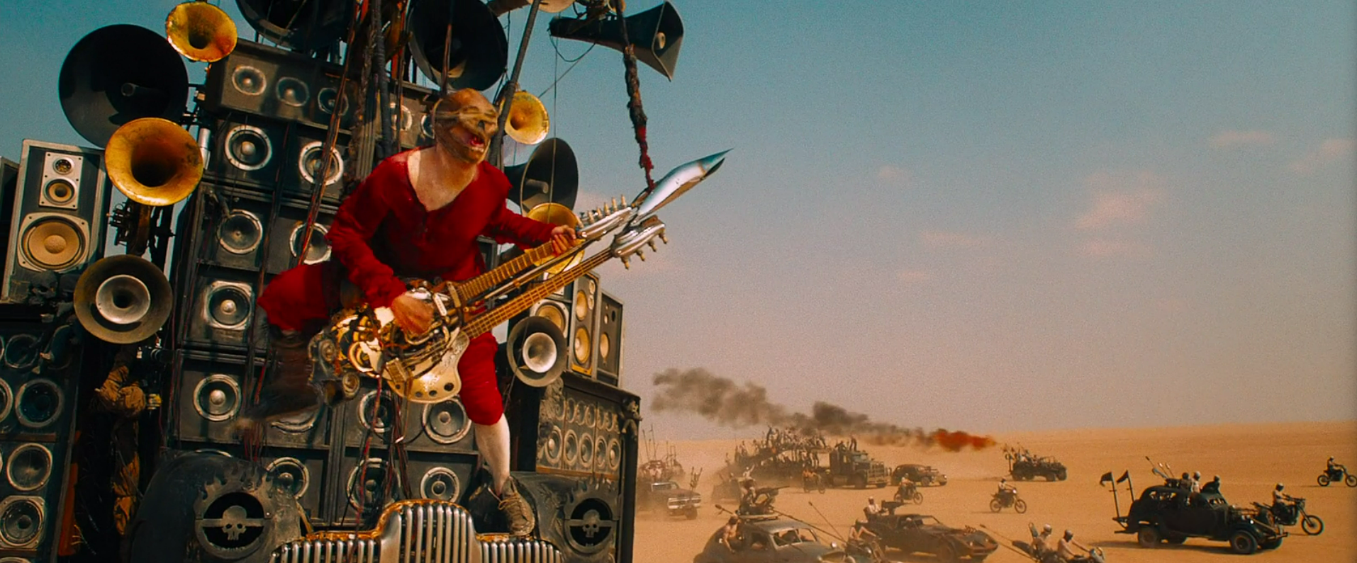 The Doof Warrior playing his flame-throwing guitar in Mad Max: Fury Road